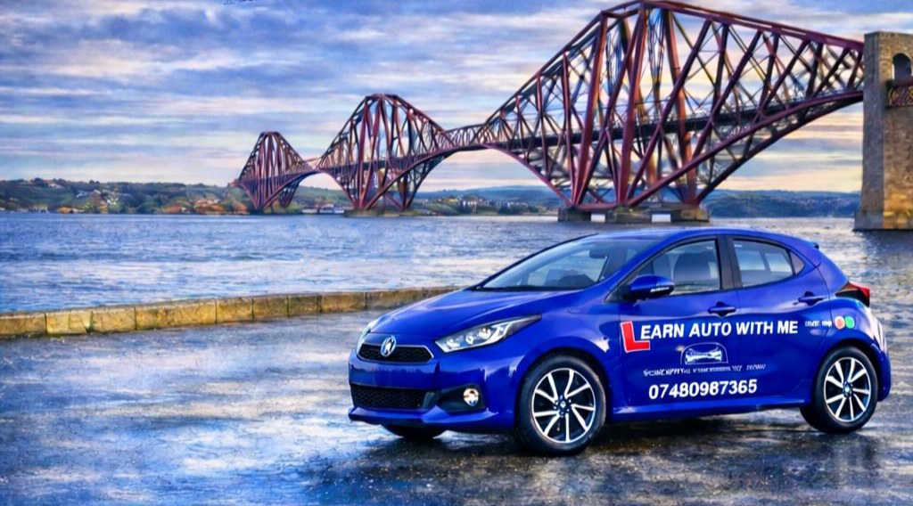 YorDrive training car, a blue Toyota Yaris, parked by the Forth Bridge